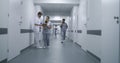 Multiracial medical staff walk clinic corridor Royalty Free Stock Photo