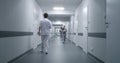 Multiracial medical staff walk clinic corridor Royalty Free Stock Photo