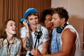 Multiracial music band performing in a recording studio Royalty Free Stock Photo