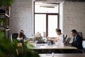 Diverse employees busy working in shared office