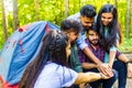 Multiracial pakistanian happy friends at picnic camping park