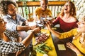 Group of friends having fun at bbq dinner in garden restaurant Royalty Free Stock Photo