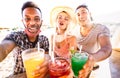 Multiracial people trio taking selfie with open face masks at beach bar Royalty Free Stock Photo