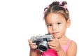 Multiracial small girl holding a compact camera Royalty Free Stock Photo