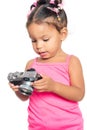 Multiracial small girl holding a compact camera Royalty Free Stock Photo