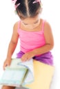 Multiracial small girl reading a book