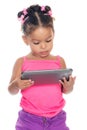 Multiracial small girl using a tablet computer