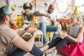 Multiracial smiling friends having party