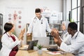 Multiracial students clapping lecturer after medical lesson Royalty Free Stock Photo