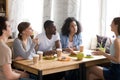 Multiracial students studying together in cafe, brainstorm, share ideas