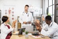 Multiracial students clapping lecturer after medical lesson Royalty Free Stock Photo