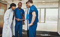 Multiracial team of doctors discussing a patient