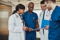 Multiracial team of doctors discussing a patient Royalty Free Stock Photo