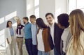 Multiracial team of happy supportive business people hugging, smiling and having fun Royalty Free Stock Photo