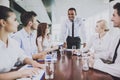 Multiracial Team Meeting in Conference Room . Royalty Free Stock Photo