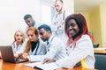 Multiracial team of young doctors working on laptop computer in medical office. Royalty Free Stock Photo