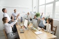 Multiracial team of young and senior people launching paper plan Royalty Free Stock Photo