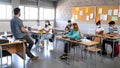 Multiracial teenage high school students wearing face mask listen to teacher explaining lesson. Panoramic image. Royalty Free Stock Photo