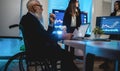 Multiracial trader team making stock market analysis conference inside hedge fund office - Focus on senior man face sitted in