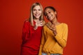 Multiracial two girls laughing while posing with cookies Royalty Free Stock Photo