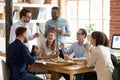 Multiracial work team eating pizza together on break Royalty Free Stock Photo