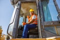 Manual worker driving cargo truck in plant Royalty Free Stock Photo