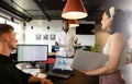 Multiracial young colleagues discussing during meeting in creative office Royalty Free Stock Photo