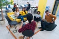Multiracial young creative people in modern office. Group of young business people are working together with laptop, tablet, smart Royalty Free Stock Photo