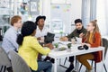 Multiracial young people discussing new startup project Royalty Free Stock Photo