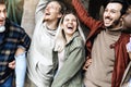 Multiracial young people laughing and celebrating victory event outside - Happy group of friends having fun together walking on Royalty Free Stock Photo