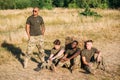 multiracial young soldiers in military uniform resting Royalty Free Stock Photo