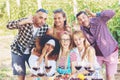 Happy mixed race friends taking selfie with funny faces at picnic summer party Royalty Free Stock Photo