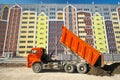 Multistorey building apartment house and dump truck unload soil