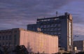 multistory city panel apartment house against the evening sky. sunlight reflection Royalty Free Stock Photo