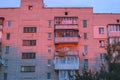 multistory city panel apartment house against the evening sky. sunlight reflection Royalty Free Stock Photo