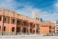 Multistory condominium building under development with elevator shaft and metal fencing near Dallas