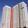 Multistory new modern apartment building against the blue sky. Stylish living block of flats. Newly built block of flats Royalty Free Stock Photo