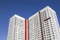 Multistory new modern apartment building against the blue sky. Stylish living block of flats. Newly built block of flats Royalty Free Stock Photo