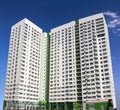 Multistory new modern apartment building against the blue sky. Stylish living block of flats. Newly built block of flats Royalty Free Stock Photo