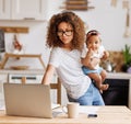 Multitasking african american self-employed mother working with baby from home on maternity leave Royalty Free Stock Photo