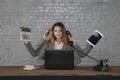 Multitasking business woman sitting at desk Royalty Free Stock Photo