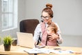 Businesswoman working with her baby son at the office Royalty Free Stock Photo