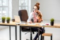 Businesswoman working with her baby son at the office Royalty Free Stock Photo