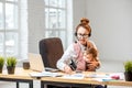 Businesswoman working with her baby son at the office Royalty Free Stock Photo