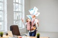 Businesswoman with her baby son working with documents at the office Royalty Free Stock Photo