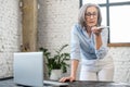 Multitasking senior businesswoman on a phone call Royalty Free Stock Photo