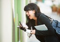 Multitasking Woman Opening Door