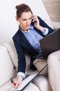 Multitasking woman working at home Royalty Free Stock Photo