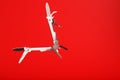 Multitool is a multi-functional tool on a red background. The concept of an open, flying multi-tool with free space Royalty Free Stock Photo