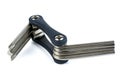 Multitool for repair of bicycles with various attachments with allen wrenches and screwdrivers on white